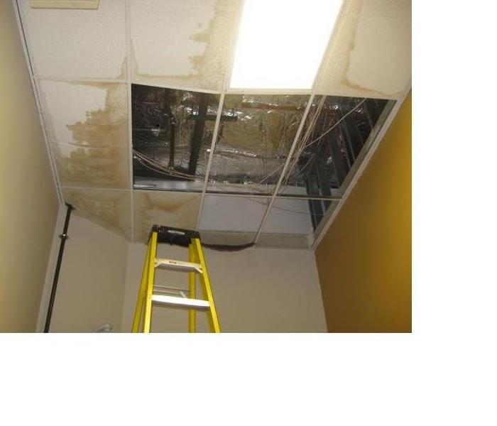Ceiling tile damaged in Building from rook leak 
